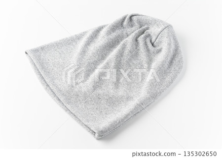 Light grey knit hat on a white background 135302650