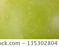 Green apple as a background macro photo texture. 135302804