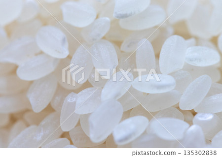 Close up on white rice grains Close up on white rice grains 135302838
