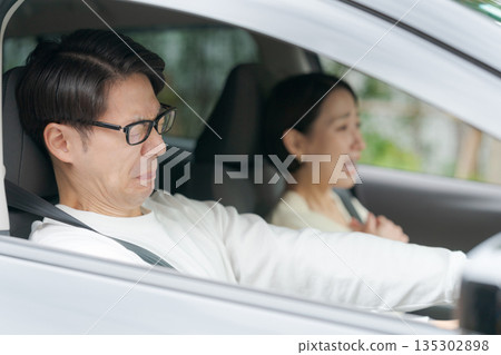 Couple having car trouble 135302898