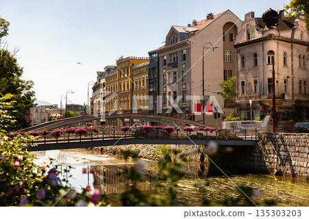 Embankment of Miljacka River in Sarajevo in summer. Bosnia and Herzegovina 135303203