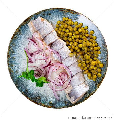 Herring with chopped onion and green peas on a round plate Herring with chopped onion and green peas on a round plate 135303477