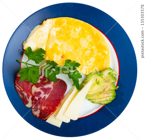 Omelet with avocado, jamon and cheese on a plate Omelet with avocado, jamon and cheese on a plate 135303578