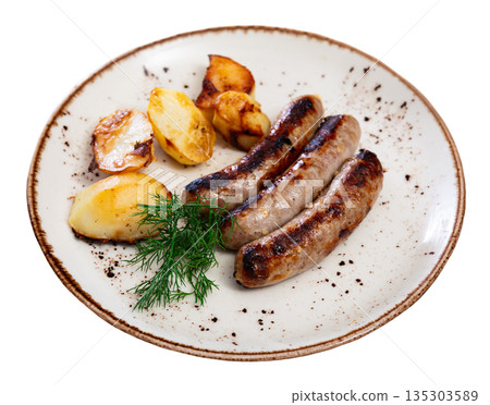 Hearty meal consists of fried sausages and potatoes Hearty meal consists of fried sausages and potatoes 135303589