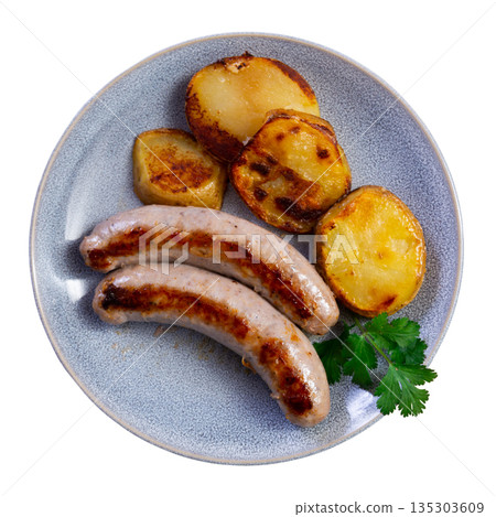 Cooked sausages with potatoes on a plate Cooked sausages with potatoes on a plate 135303609