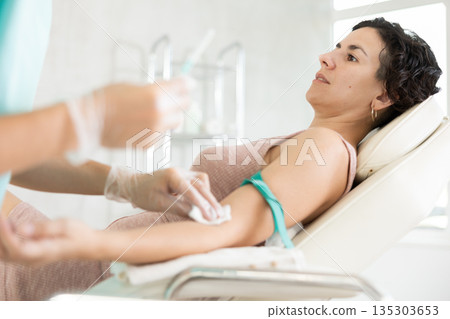 Intravenously injection female patient 135303653