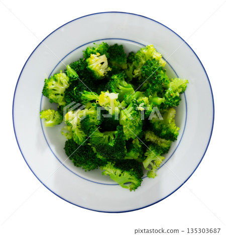 Plate of freshly roasted green broccoli for healthy vegetarian lunch 135303687