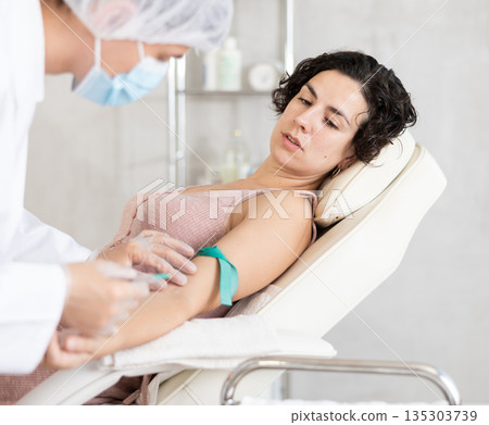 Intravenously injection female patient 135303739