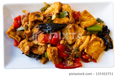 Stewed tofu with vegetables on a plate Stewed tofu with vegetables on a plate 135303751