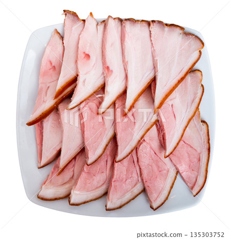 Plate is filled with slices of smoked meat fore shank. Plate is filled with slices of smoked meat fore shank. 135303752