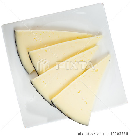 Light snack - slices of manchego cheese on plate Light snack - slices of manchego cheese on plate 135303786