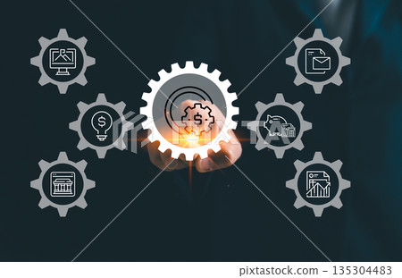 Business finance automation concept with hand touching digital gear and dollar icon, linking banking, budgeting, analytics, reports and savings for efficient financial management and fintech workflow. 135304483