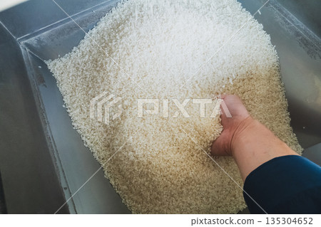 Rice polishing with a coin-operated rice polisher Rice polishing with a coin-operated rice polisher 135304652