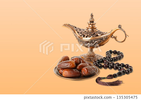 Festive arrangement of dates and lantern for Ramadan celebration Festive arrangement of dates and lantern for Ramadan celebration 135305475