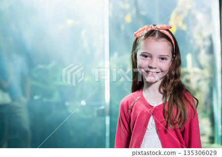 Female child viewing plants through glass at aquarium wearing cardigan and headband, copy space Female child viewing plants through glass at aquarium wearing cardigan and headband, copy space 135306029