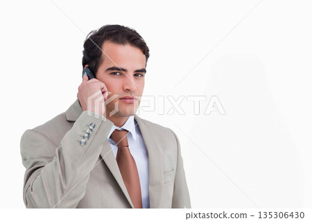 Man in his late twenties talking on smartphone in studio portrait with white background, copy space Man in his late twenties talking on smartphone in studio portrait with white background, copy space 135306430