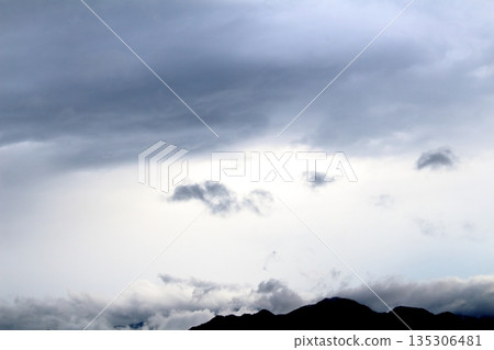 A colored paper woven with sky and clouds. Sky and clouds of Shinshu A colored paper woven with sky and clouds. Sky and clouds of Shinshu 135306481