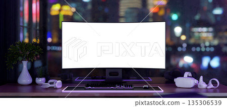 White screen computer and vision headset on table with neon purple backlighting and night city view. White screen computer and vision headset on table with neon purple backlighting and night city view. 135306539