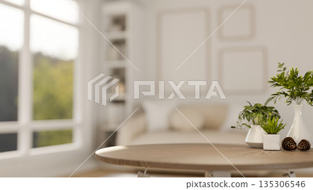 Decorative acorns with vase and green pot plants on wooden table in a white living room with sofa. Decorative acorns with vase and green pot plants on wooden table in a white living room with sofa. 135306546