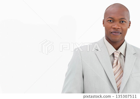 Adult African American man standing in studio wearing suit collared shirt striped tie, copy space Adult African American man standing in studio wearing suit collared shirt striped tie, copy space 135307511