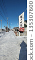 a sign on a snowy mountain slope 135307600