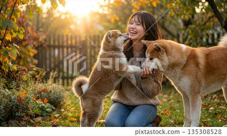 Akita dog and smiling Japanese woman 135308528