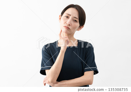 Young woman wearing beauty salon uniform Beauty image Young woman wearing beauty salon uniform Beauty image 135308735