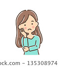 A young woman tilting her head and thinking / Single item 135308974