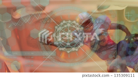 Showing helmeted football player holding ball at data panel, with holographic interface, copy space 135309111