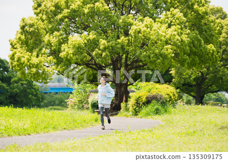 Young woman running sports image Young woman running sports image 135309175