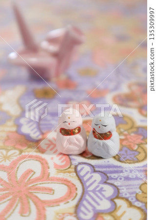 Cute Jizo statues and cranes 135309997
