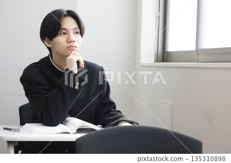Male high school student studying Male high school student studying 135310898