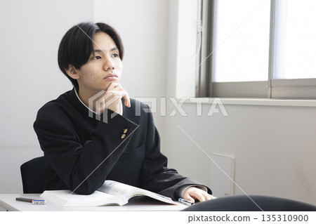 Male high school student studying Male high school student studying 135310900
