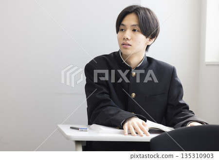Male high school student studying 135310903