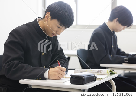 Male high school student studying Male high school student studying 135311005