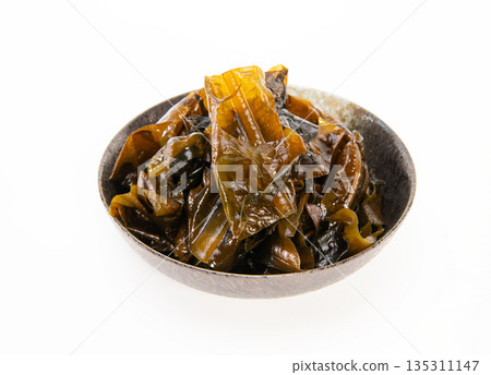 Brown seaweed in black bowl.Japanese food. Brown seaweed in black bowl.Japanese food. 135311147