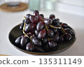 Black grape on black plate. 135311149