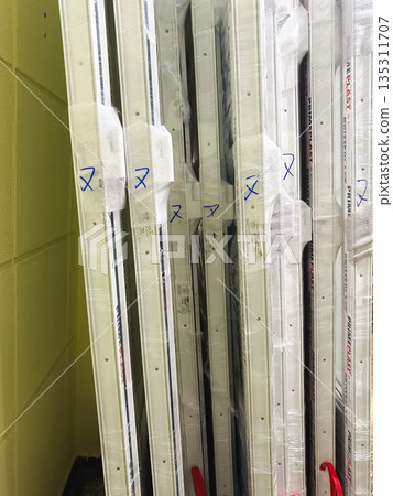 Stack of sealed window frames in protective packaging. Stack of sealed window frames in protective packaging. 135311707