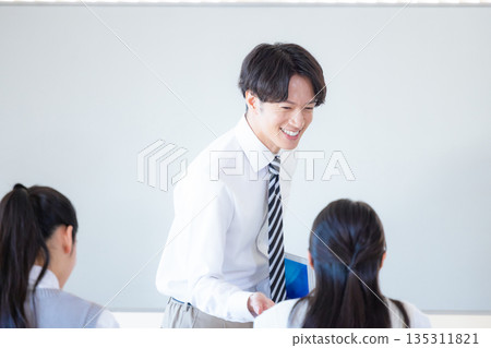 Students and instructors studying at a cram school Students and instructors studying at a cram school 135311821
