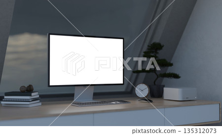 White screen and portable computer with book and clock aside bonsai pot on table in dim attic room. 135312073
