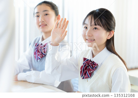 Junior high school girls studying at cram school Junior high school girls studying at cram school 135312108