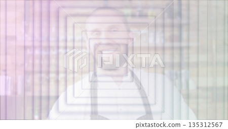 Standing man wearing dark apron arranging glass jars on wooden shelves at café, brick wall backdrop Standing man wearing dark apron arranging glass jars on wooden shelves at café, brick wall backdrop 135312567