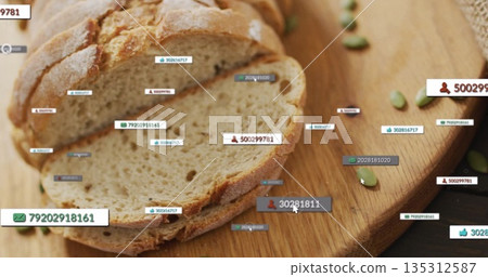 Displaying rustic loaf bread slices and digital tags on wooden board in kitchen, with pumpkin seeds Displaying rustic loaf bread slices and digital tags on wooden board in kitchen, with pumpkin seeds 135312587