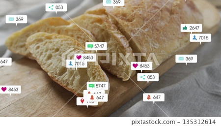 Partially sliced baguette resting on wooden cutting board on grey tabletop, with notification icons Partially sliced baguette resting on wooden cutting board on grey tabletop, with notification icons 135312614