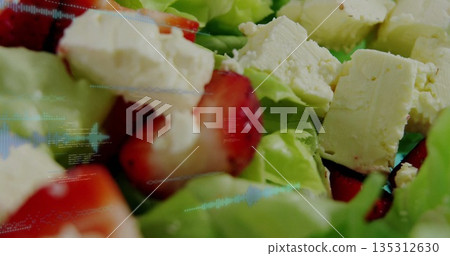 Salad featuring green lettuce strawberry slices, crumbled white cheese on plate, digital overlay Salad featuring green lettuce strawberry slices, crumbled white cheese on plate, digital overlay 135312630