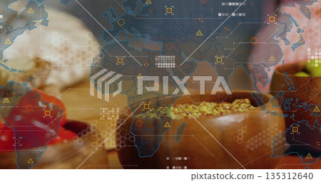 Presenting wooden bowl holding seed spice mix on kitchen counter with chili peppers and map overlay Presenting wooden bowl holding seed spice mix on kitchen counter with chili peppers and map overlay 135312640