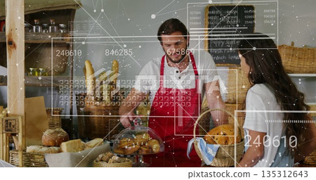 Offering apron-clad clerk pastry under dome to customer with basket at bakery counter with overlays 135312643