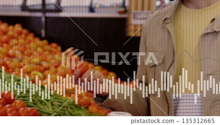 Man in beige jacket selecting tomatoes in supermarket produce section with red tomatoes, copy space Man in beige jacket selecting tomatoes in supermarket produce section with red tomatoes, copy space 135312665