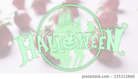 Featuring Halloween graphic with jack-o'-lantern and cat silhouettes in studio, with strawberries Featuring Halloween graphic with jack-o'-lantern and cat silhouettes in studio, with strawberries 135312666