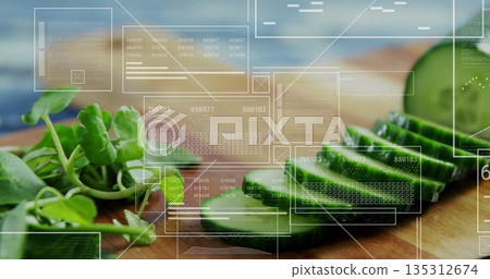 Showing sliced cucumber and watercress on wood cutting board on counter, with digital data overlays Showing sliced cucumber and watercress on wood cutting board on counter, with digital data overlays 135312674